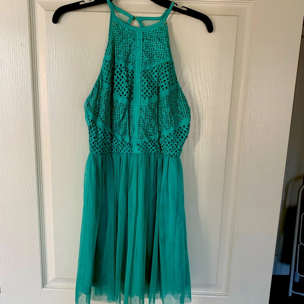 Babydoll style mint dress with a fun top and tulle bottom! Only worn twice!